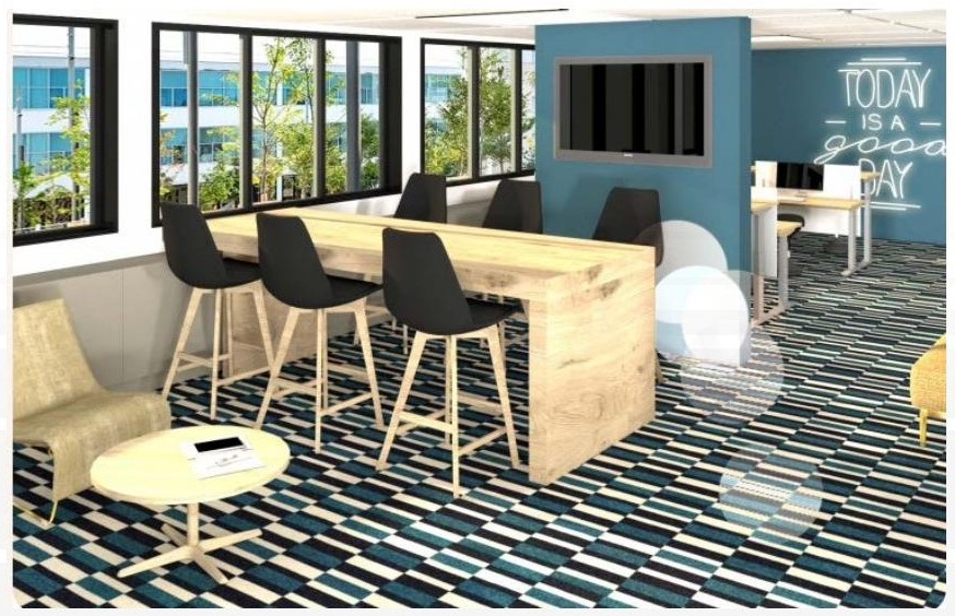 Espace collaboratif avec moquette bleue et coin lounge — bureaux CSM